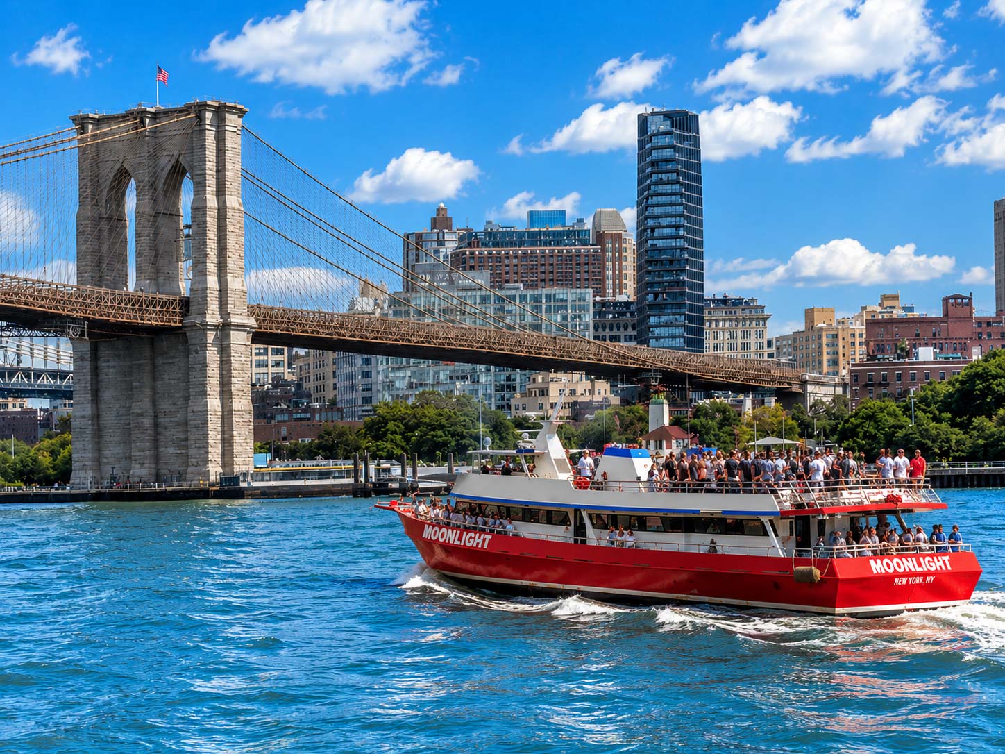 Private yacht charter cruising through New York Harbor near Manhattan and the Statue of Liberty