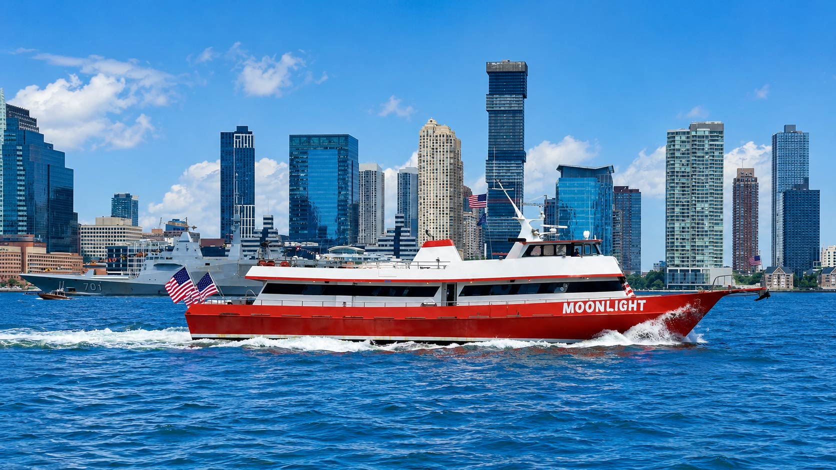 Private party yacht charter cruising through New York Harbor near the Manhattan skyline
